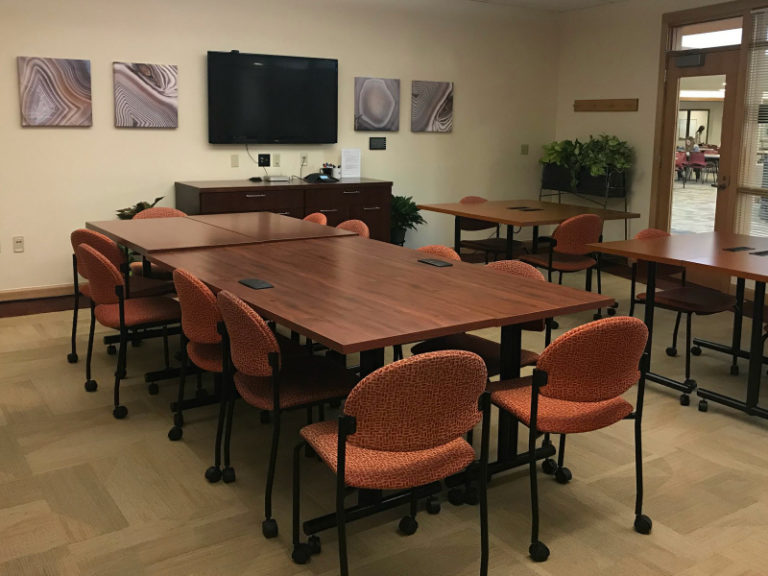 Photograph of tables and chairs in the OTL conference room.