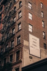 How are you really? sign on building