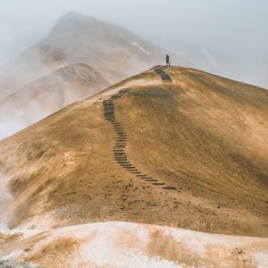 Person climbing a mountain