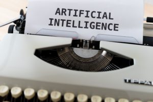 Typewriter with paper saying Artificial Intelligence